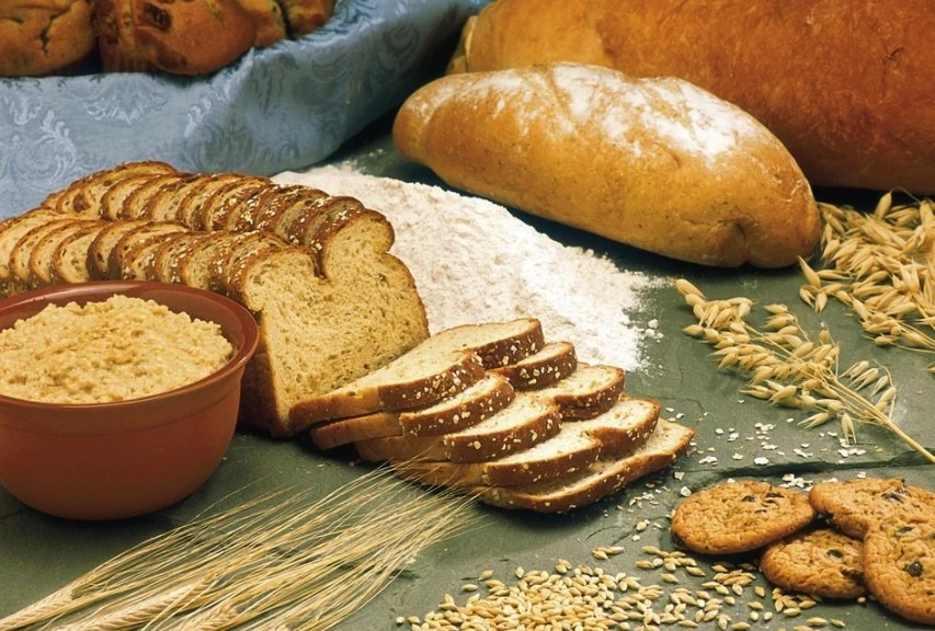 bread, cereals, oats, and wheat on a table