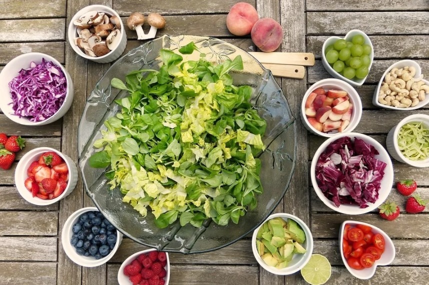 different types of healthy foods on a wooden table