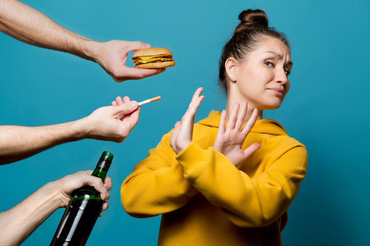 girl in bright clothes refuses junk food, alcohol and cigarettes
