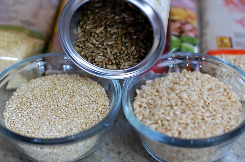 brown rice, quinoa, and freekeh in containers
