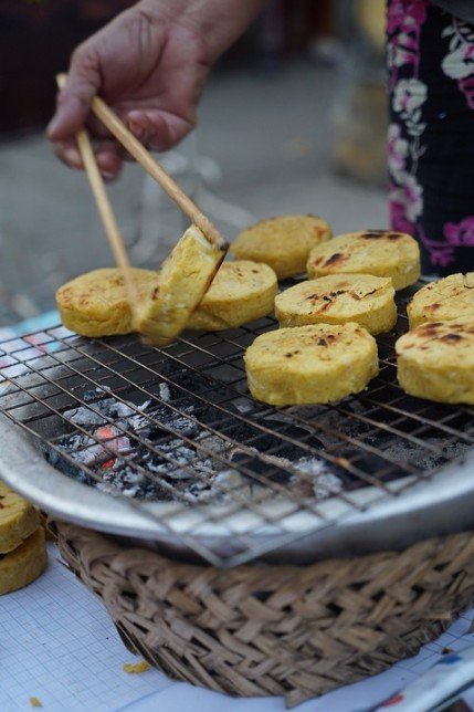 Peeled, round pieces of sweet potatoes being grilled