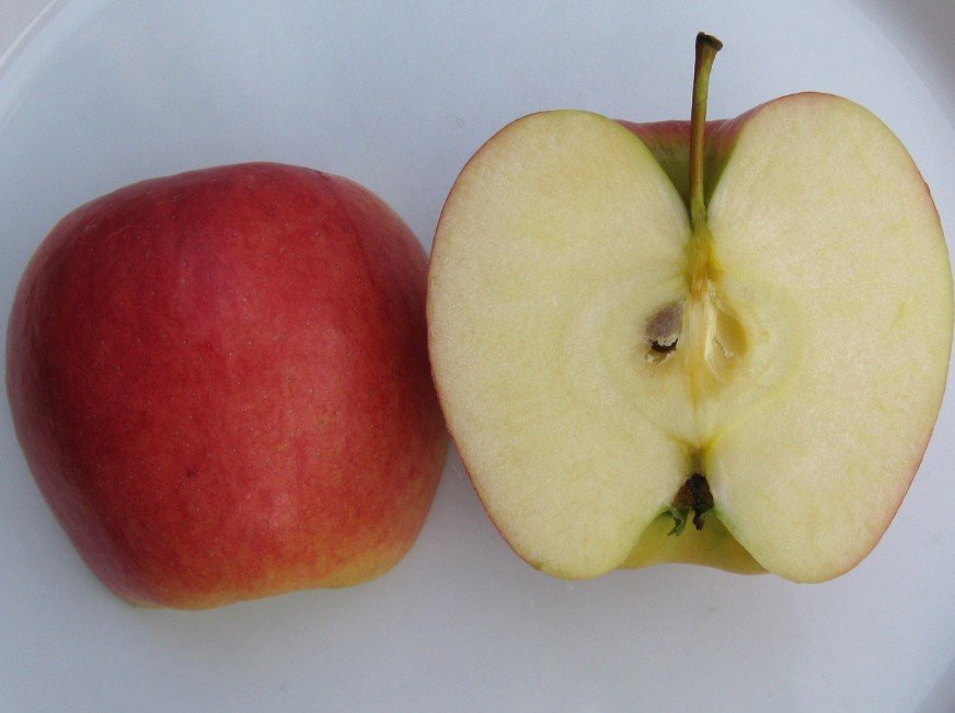 Ambrosia apple cut in half
