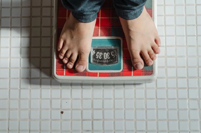 person on a weighing scale
