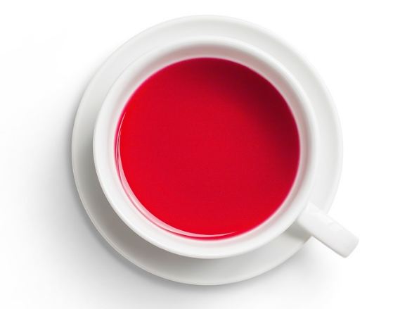 Image of red hibiscus tea in a cup.