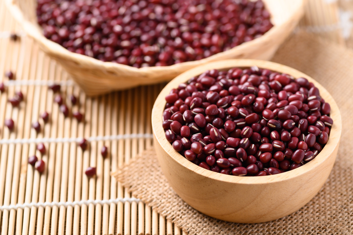 Azuki beans or red mung beans in a wooden bowl