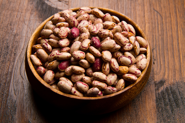 pinto beans on wood bowl