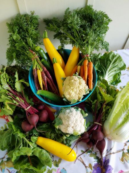 a basket full of exotic vegetables