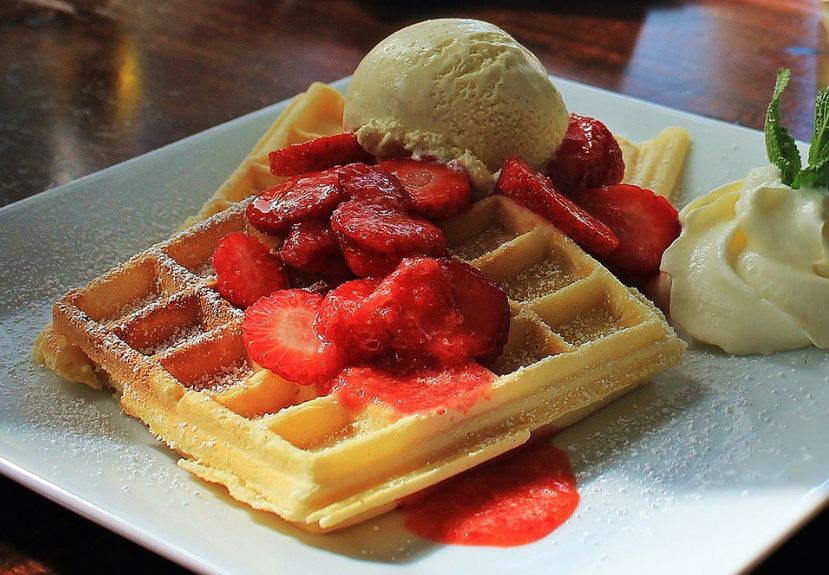 waffles-on-a-plate-strawberry-and-ice-cream-toppings-mint-leaves