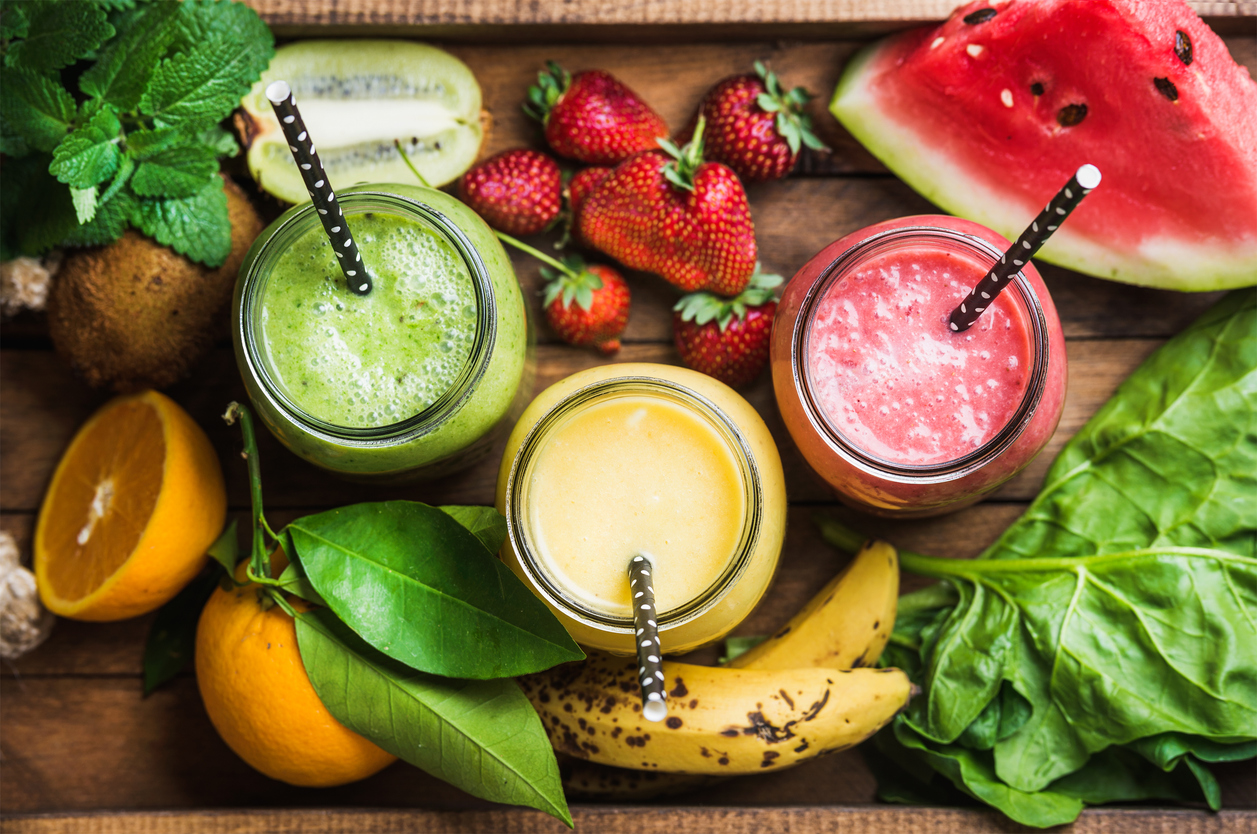 glasses of smoothies made of different fruits and vegetables